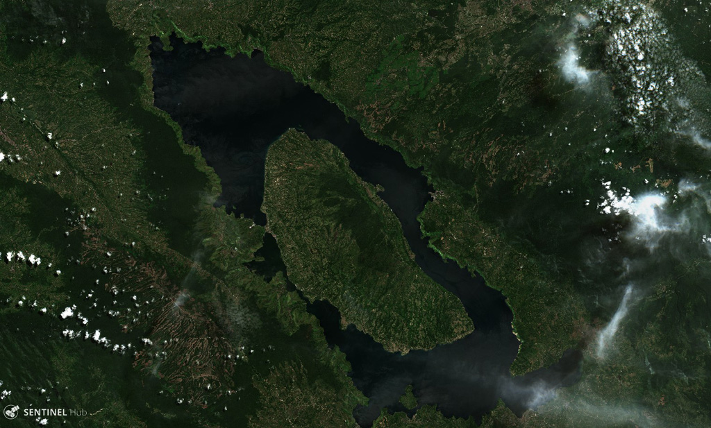 The 30 x 100 km Toba caldera formed during four major eruptions, the most recent occurring 74,000 years ago when it erupted the Young Toba Tuff. Samosir Island is an area of resurgence within the caldera, formed by uplifting of the caldera floor by at least 1.1 km over thousands of years. N is at the top of this 21 June 2019 Sentinel-2 satellite image. Satellite image courtesy of Copernicus Sentinel Data, 2019.