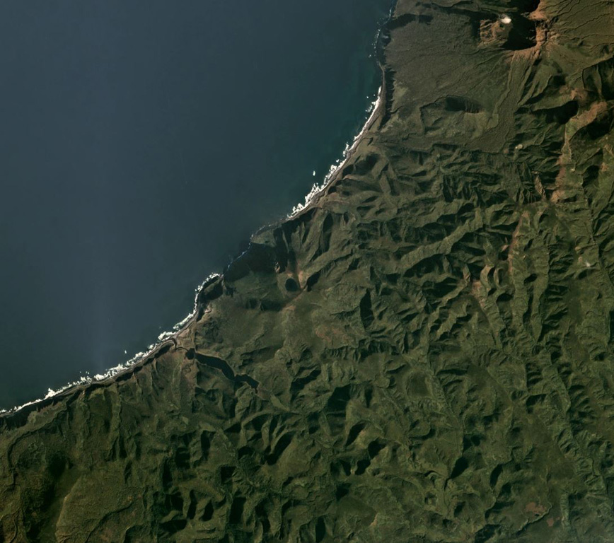 Rudakov volcano contains a 300-m-wide lake within the summit crater, visible near the center of this  October 2019 Planet Labs satellite image mosaic (N is at the top). It is located along the W coast of central Urup Island in the Kurils. Satellite image courtesy of Planet Labs Inc., 2019 (https://www.planet.com/).