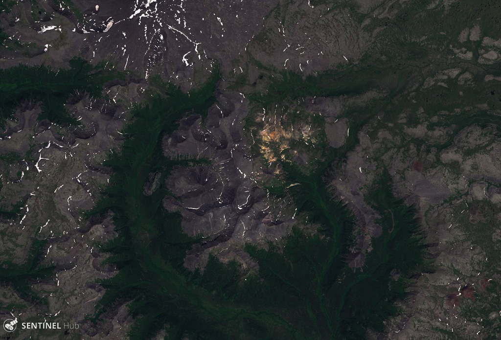 The 12-km-diameter Uksichan summit caldera is visible in this 25 July 2019 Sentinel-2 satellite image (N is at the top). The complex includes a large shield volcano, scoria cones, lava domes, and lava flows out to 15-20 km. This image is approximately 24 km across. Satellite image courtesy of Copernicus Sentinel Data, 2019.