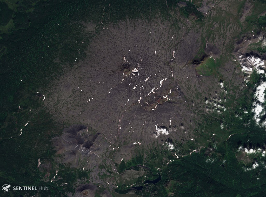 The broad Kebeney volcano in the central Sredinny Range, Kamchatka, is shown here in this 21 August 2019 Sentinel-2 satellite image (N is at the top). Scoria cones have formed on its flanks. This image is approximately 20 km across. Satellite image courtesy of Copernicus Sentinel Data, 2019.
