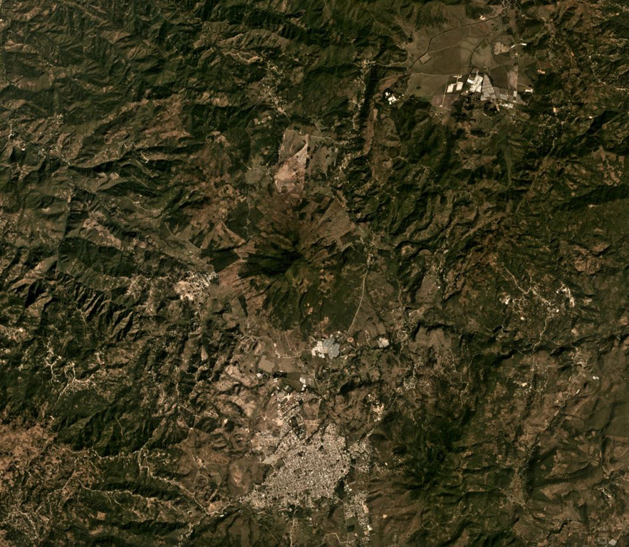The Jumay Volcanic Field includes the cone in the center of this December 2019 Planet Labs satellite image monthly mosaic (N is at the top; the image is approximately 20 km across), N of Jalapa city. This cone has a shallow crater and eroded flanks. Satellite image courtesy of Planet Labs Inc., 2019 (https://www.planet.com/).