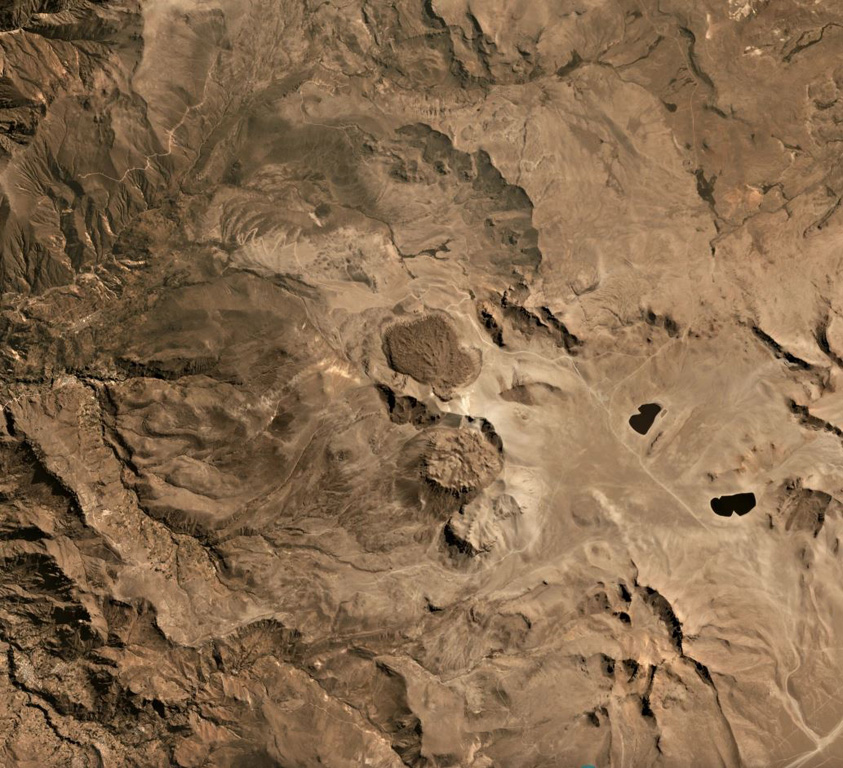 Lava domes of Ticsani volcano are shown in the center of this August 2019 Planet Labs satellite monthly mosaic (N is at the top). The previous edifice collapsed to form an estimated 12 km3 debris avalanche deposit and has since emplaced these lava domes. This image is approximately 18.5 km across. Satellite image courtesy of Planet Labs Inc., 2019 (https://www.planet.com/).