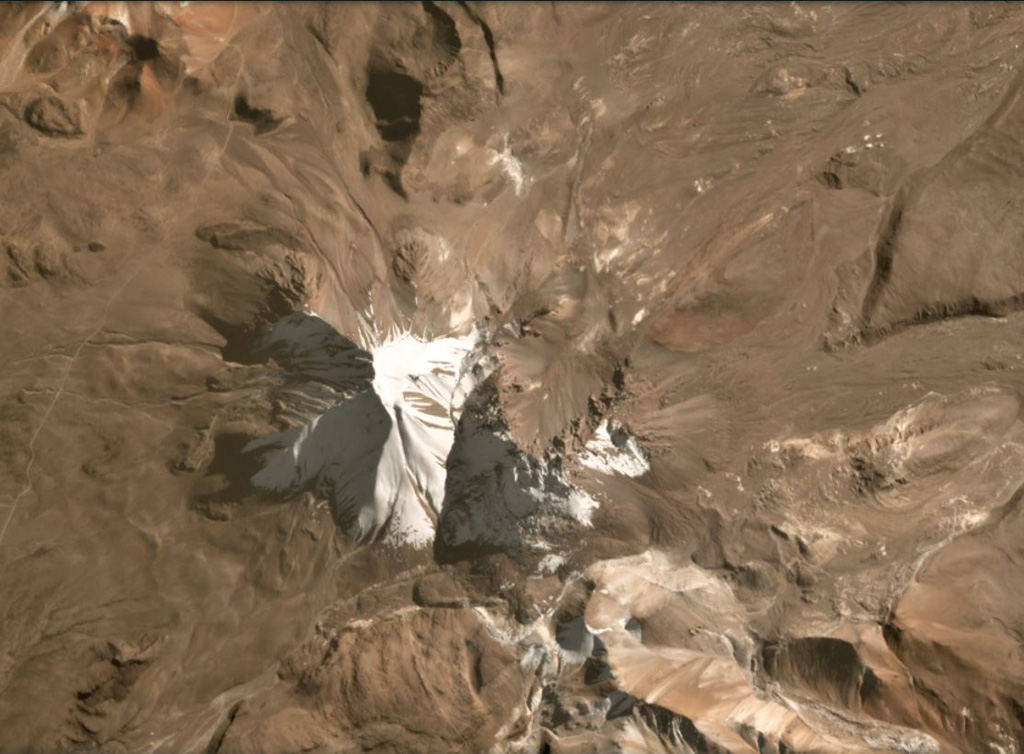 Tutupaca consists of two eroded edifices that are seen in the center of this July 2020 Planet Labs satellite image monthly mosaic (N is at the top; the image is approximately 10 km across). The complex contains lava domes and a number of these have undergone collapse. The eastern edifice has a horseshoe-shaped collapse scarp that opens towards the NE. Satellite image courtesy of Planet Labs Inc., 2020 (https://www.planet.com/).