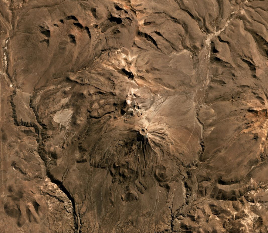 Volcán Yucamane is composed of three main edifices, Yucamane Chico to the N, El Calientes in the middle, and Volcán Yucamane at the southern end, seen in this July 2019 Planet Labs satellite image monthly mosaic (N is at the top; the image is approximately 19.5 km across). Levees and pressure ridges are visible on lobate lava flows on the flanks. Satellite image courtesy of Planet Labs Inc., 2019 (https://www.planet.com/).