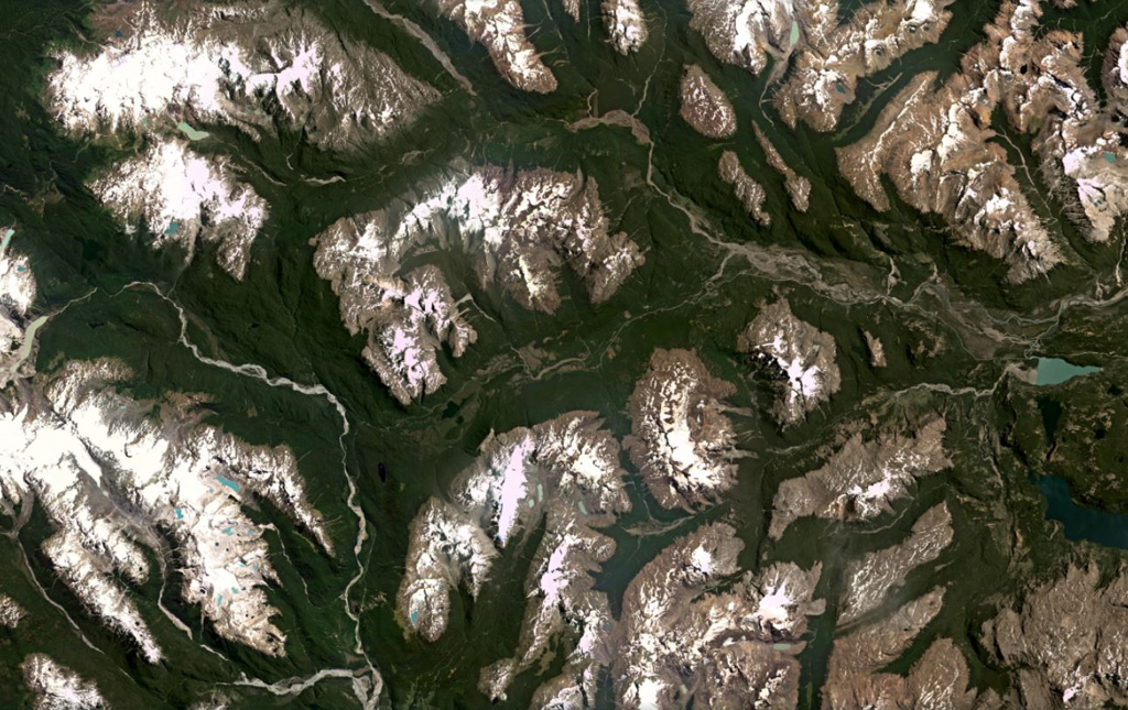 Basaltic lava flows are exposed in the valley across the center of this January 2021 Planet Labs satellite image monthly mosaic (N is at the top; this image is approximately 61 km across). The valley is a tributary of Río Murta to the W. The flows were emplaced partly subglacially in glacial valleys cutting granitic rocks of the North Patagonian Batholith in the southern Andes. Lava flow features include columnar jointing, pillow lavas, and lava tubes. Satellite image courtesy of Planet Labs Inc., 2021 (https://www.planet.com/).