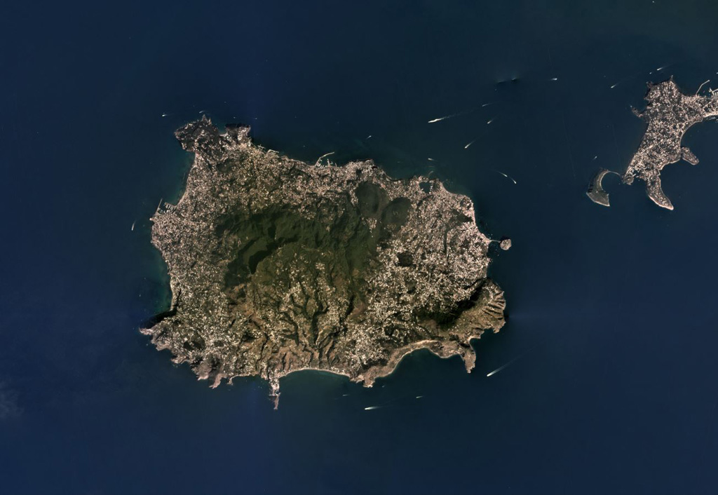 The Ischia volcanic complex forms a 6 x 9 km island in the Bay of Naples and is part of the Phlegraean Volcanic District. It is shown in this September 2019 Planet Labs satellite image monthly mosaic (N is at the top). The vegetated area is a resurgent block and the high point of the island. An arcuate collapse scarp in near the center on the island, opening towards the south. Satellite image courtesy of Planet Labs Inc., 2019 (https://www.planet.com/).