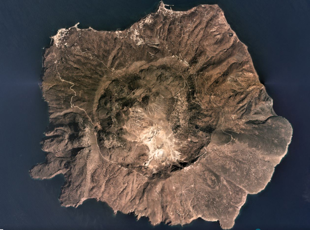 Nisyros has a 3.6-km-diameter caldera with walls 300-400 m high and is filled with lava domes, seen here in this September 2019 Planet Labs satellite image monthly mosaic (N is at the top). The edifice also has vents, scoria cones, dikes, fault systems, and geothermal features, including active fumaroles and hot springs. Satellite image courtesy of Planet Labs Inc., 2019 (https://www.planet.com/).