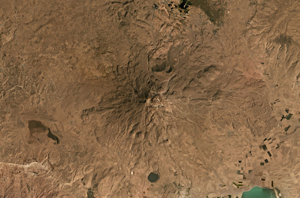 Süphan Dagi in Turkey is in the center of this September 2019 Planet Labs satellite image monthly mosaic (N is at the top; this image is approximately 40 km across). To the south is Aygirgölü maar which is just under 2 km in diameter. Lava flows are visible across the eroded flanks. Satellite image courtesy of Planet Labs Inc., 2019 (https://www.planet.com/).