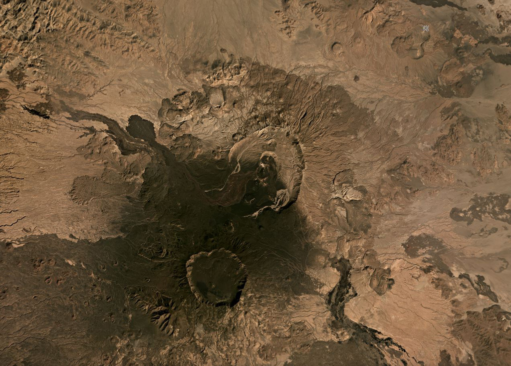 This November 2019 Planet Labs satellite image monthly mosaic shows several calderas and lava flows, with Nabro in the center and Mallahle below it, both within the Bidu Volcanic Complex of the Nabro Volcanic Range (N is at the top). The 6-km-diameter-wide Mallahle caldera contains obsidian lava flows in the northern part. Sork’Ale is partly visible to the SE. Satellite image courtesy of Planet Labs Inc., 2019 (https://www.planet.com/).