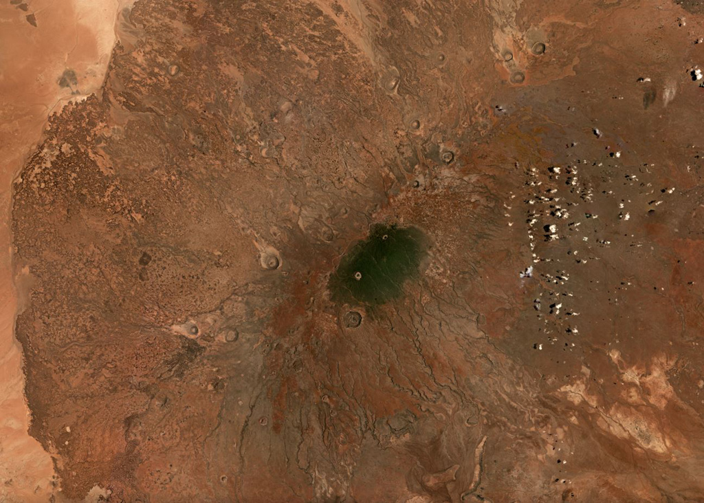 The 6,300 km2 Marsabit volcanic field contains around 550 identified features including cones, vents, and maar craters, shown in this September 2019 Planet Labs satellite image monthly mosaic (N is at the top; this image is approximately 100 km across). The crater immediately south of the darker area in the center of the image is approximately 2.5 km in diameter. Satellite image courtesy of Planet Labs Inc., 2019 (https://www.planet.com/).