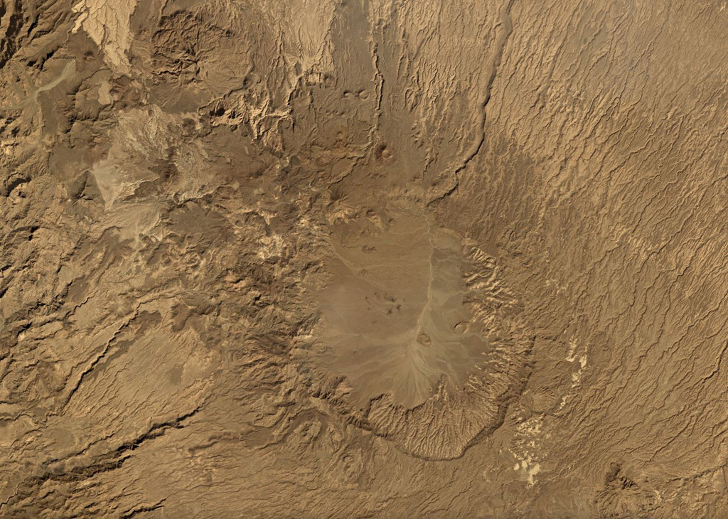 The Tarso Voon caldera within the Tibesti massif in Chad is shown in this November 2019 Planet Labs satellite image monthly mosaic (N is at the top; this image is approximately 48 km across). The Soborom geothermal field is on the W flank and several smaller cones and craters are visible along the N flank. Satellite image courtesy of Planet Labs Inc., 2019 (https://www.planet.com/).