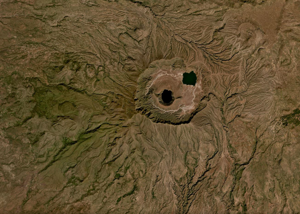 The 5-7 km Deriba caldera is part of the Jebel Marra volcanic field, located in the Darfur province of western Sudan, shown in this November 2019 Planet Labs satellite image monthly mosaic (N is at the top). It formed during an eruption 3,500 years ago that produced pyroclastic flows reaching 30 km away. The central lake is within the crater of a smaller cone. Satellite image courtesy of Planet Labs Inc., 2019 (https://www.planet.com/).