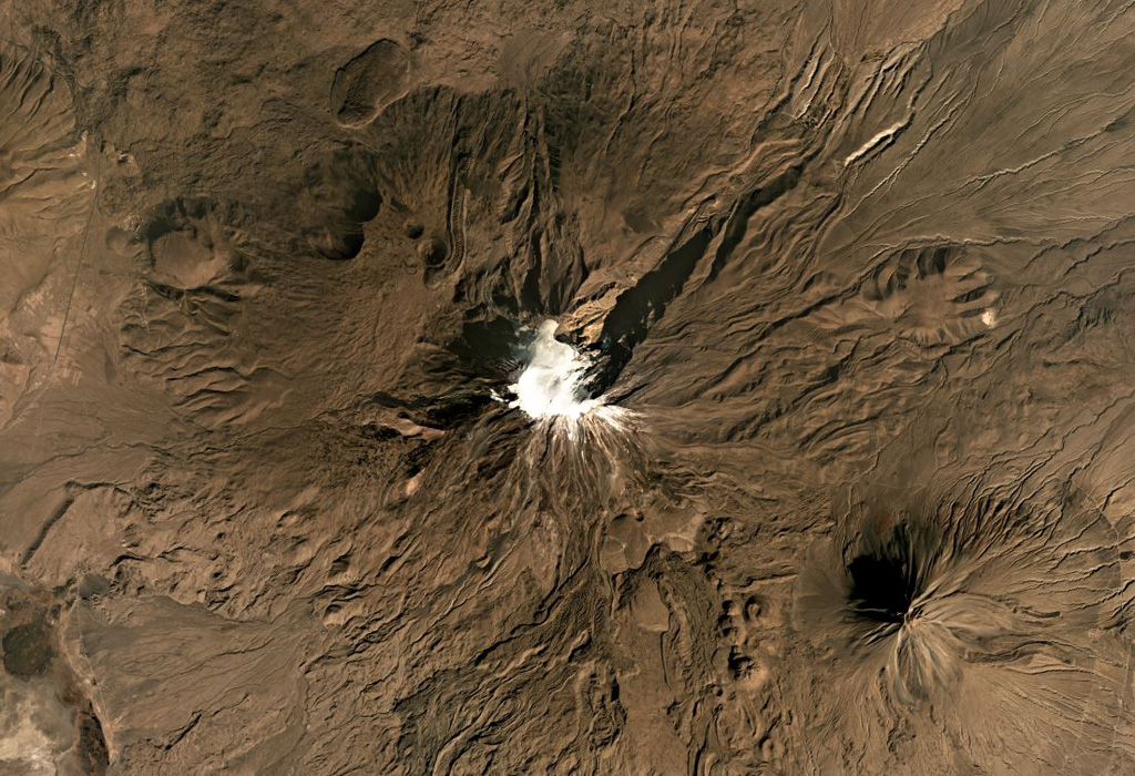 Mount Ararat has two main edifices, the glaciated Buyuk Ağrı in the center and the smaller Kucuk Ağri to the SE of this October 2019 Planet Labs satellite image monthly mosaic (N is at the top; this image is approximately 33 km across). The flanks are lava flows, lava domes, craters, and explosive deposits. Satellite image courtesy of Planet Labs Inc., 2019 (https://www.planet.com/).