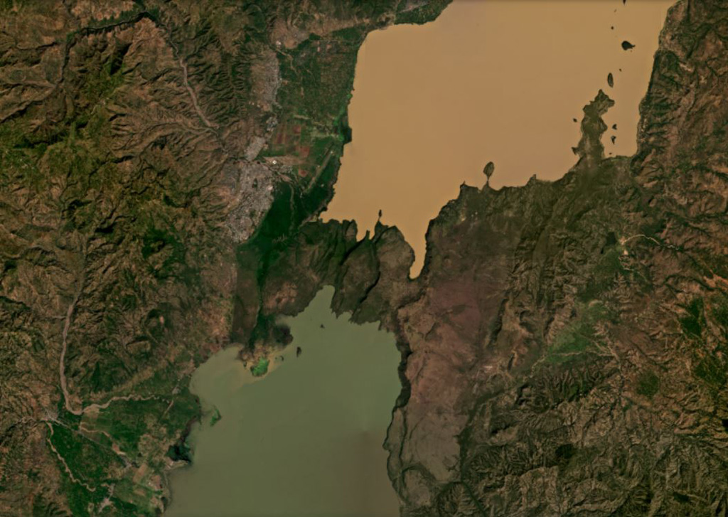 A group of Tosa Sucha scoria cones are near the northern shore of Lake Chamo, the green lake at the bottom of this December 2020 Planet Labs satellite image monthly mosaic (N is at the top; this image is approximately 44 km across). The cones erupted in and around the intensely faulted area between the lakes, and within Lake Chamo. Satellite image courtesy of Planet Labs Inc., 2020 (https://www.planet.com/).