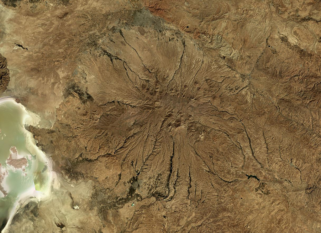 Sahand in NW Iran has heavily eroded flanks, seen in this  October 2019 Planet Labs satellite image monthly mosaic (N is at the top; this image is approximately 150 km across). A caldera formed at the summit which has been largely infilled by more recent activity. Eruptive deposits from Sahand were emplaced over an area of around 3,000 km2 and lava domes and smaller cones have formed across the flanks. Satellite image courtesy of Planet Labs Inc., 2019 (https://www.planet.com/).