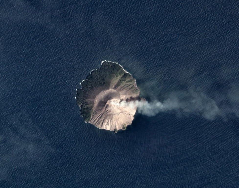 A plume at Kadovar is dispersing to the E in this November 2019 Planet Labs satellite image monthly mosaic (N is at the top). The flanks of the roughly 1.4 x 1.6 km island have been stripped of vegetation due to lava dome formation and collapse at the summit, with recent eruptive activity producing ash plumes and pyroclastic flows. Activity has also recently occurred at the base of the SE flank. Satellite image courtesy of Planet Labs Inc., 2019 (https://www.planet.com/).