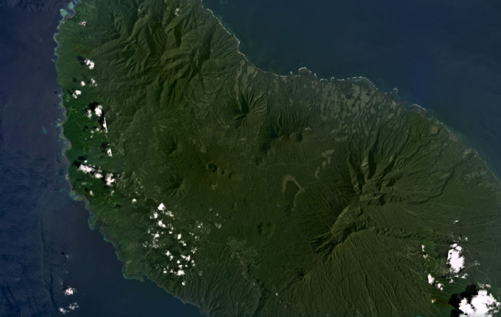 Umboi Island is around 50 km long in the NW-SE direction and has volcanic features visible in the NW, in the center of this January 2021 Planet Labs satellite image monthly mosaic (N is at the top; this image is approximately 40 km across). The larger crater near the top of the center of the island (N of the lake) is Bono of Soal volcano, and W is the eroded Barik cone. S of that is a NNW-SEE trend of craters named Pung, Talo, Apalong, and Tanglup from W to E. Satellite image courtesy of Planet Labs Inc., 2021 (https://www.planet.com/).