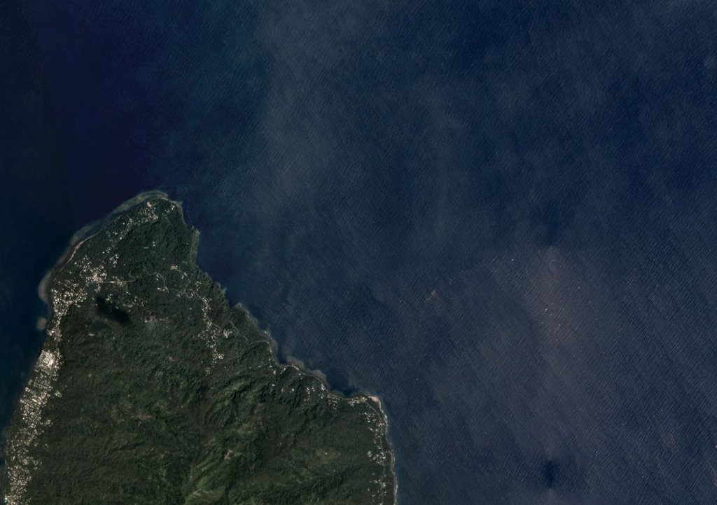 The 9-10 km wide Tavui Caldera off the Gazelle Peninsula in New Britain is along the NE coastline and up to 1.1 km below the ocean surface within the area shown in this November 2019 Planet Labs satellite image monthly mosaic (N is at the top; this image is approximately 14 km across). The caldera contains two cones, one 4.5 km wide in the northern area and the other 1.5 km wide in the northeastern area. Satellite image courtesy of Planet Labs Inc., 2019 (https://www.planet.com/).