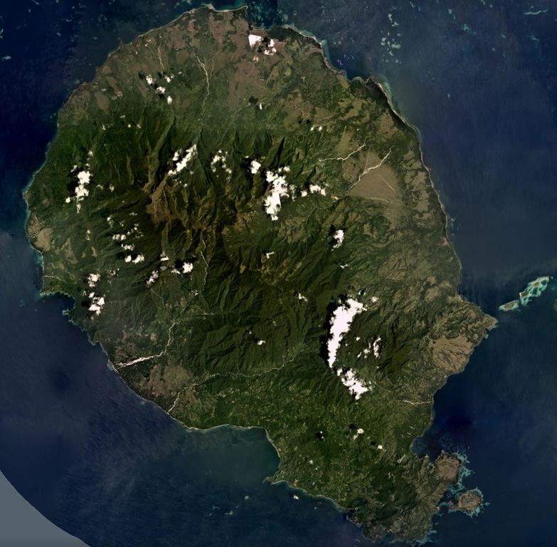 Goodenough Island is the westernmost of the D'Entrecasteaux Islands, Papua New Guinea, shown in this December 2019 Planet Labs satellite image monthly mosaic (N is at the top; this image is approximately 37 km across). The island has several cones around the outer perimeter of the island, surrounding the metamorphic rocks that form the center. The youngest features, such as the Wailagi Cones, are located on the Bwaido Peninsula to the SE. Satellite image courtesy of Planet Labs Inc., 2019 (https://www.planet.com/).