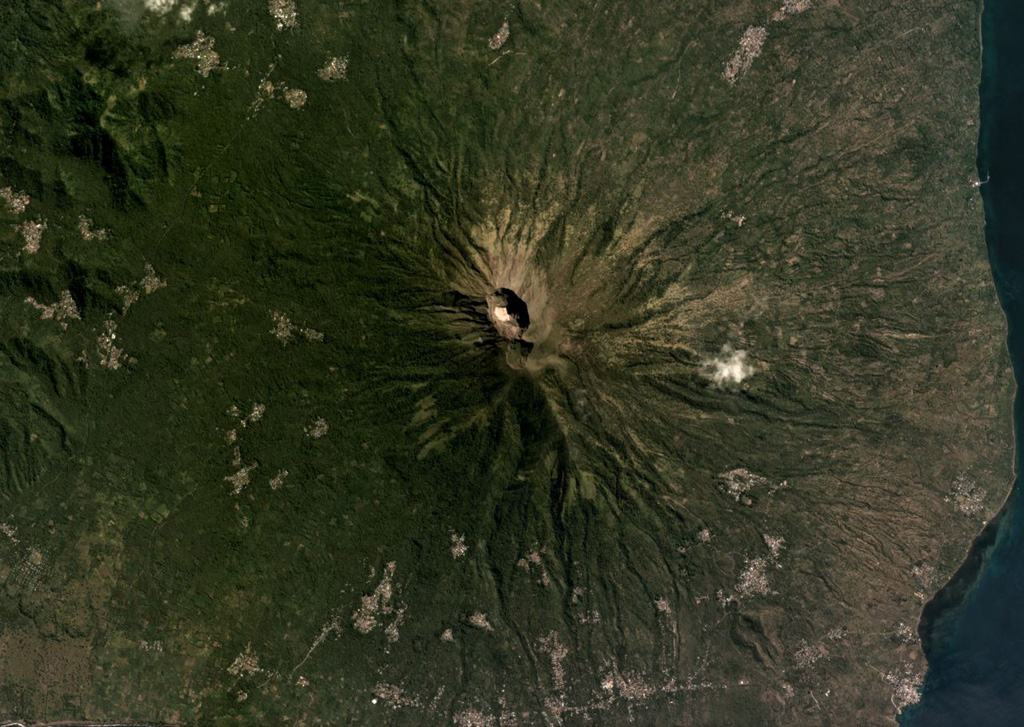 The summit craters of Iliboleng are near the center of this May 2019 Planet Labs satellite image monthly mosaic (N is at the top). The larger crater is approximately 500 x 700 m. Satellite image courtesy of Planet Labs Inc., 2019 (https://www.planet.com/).