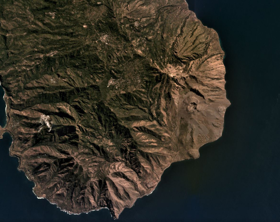Iliwerung forms a peninsula in southern Lembata island, seen here in this July 2019 Planet Labs satellite image monthly mosaic (N is at the top; this image is approximately 11 km across). The 330 x 400 m recent crater is near the eastern coastline in this view and submarine eruptions have produced ephemeral islands off the SE flank. Satellite image courtesy of Planet Labs Inc., 2019 (https://www.planet.com/).