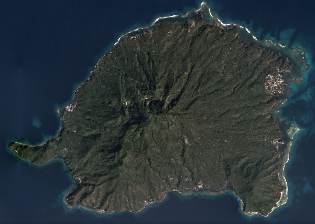 The eroded Balut edifice is in the center of this December 2019 Planet Labs satellite image monthly mosaic (N is at the top). Hot springs and thermally altered ground are located on the W and SW flanks. The island is approximately 11 km in the E-W direction. Satellite image courtesy of Planet Labs Inc., 2019 (https://www.planet.com/).