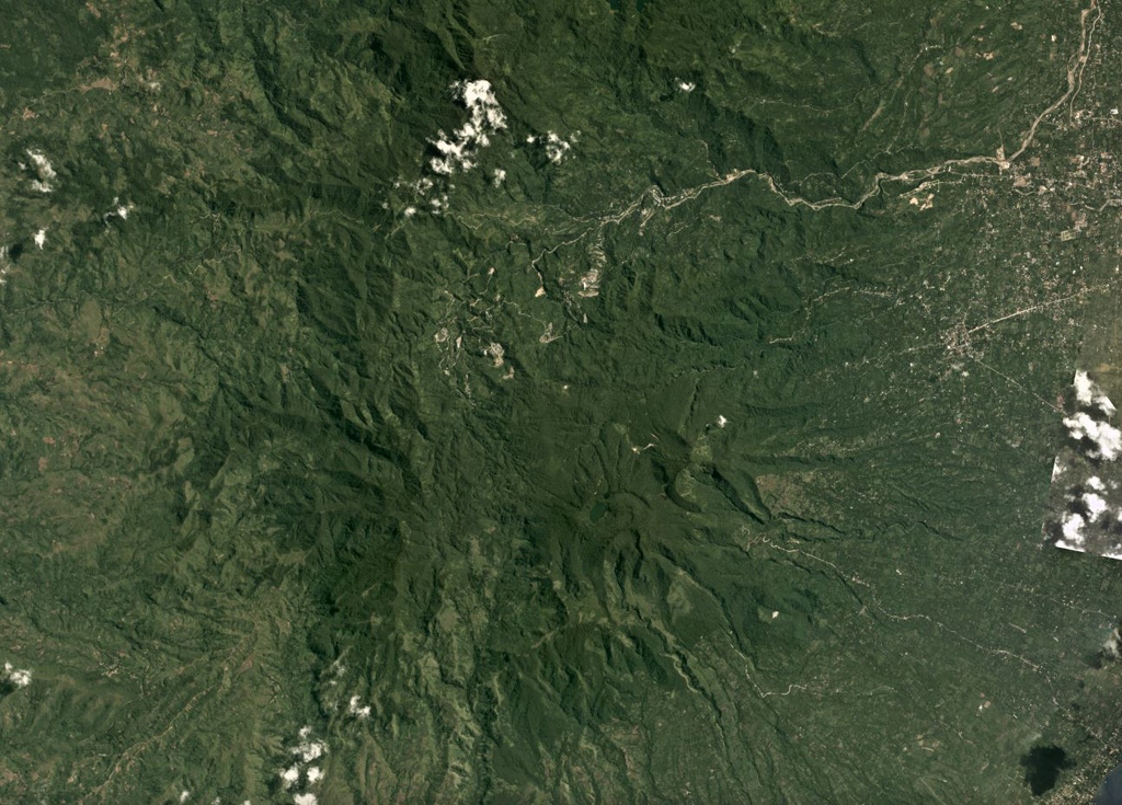 Cuernos de Negros is a large volcano composed of multiple edifices including Mount Talines, Mount Guinsayawan, and Guintabon Dome, seen in this June 2017 Planet Labs satellite image monthly mosaic (N is at the top; this image is approximately 24 km across). The Magaso summit crater contains active fumaroles and the Palinpinon geothermal field is on a N flank. Satellite image courtesy of Planet Labs Inc., 2017 (https://www.planet.com/).