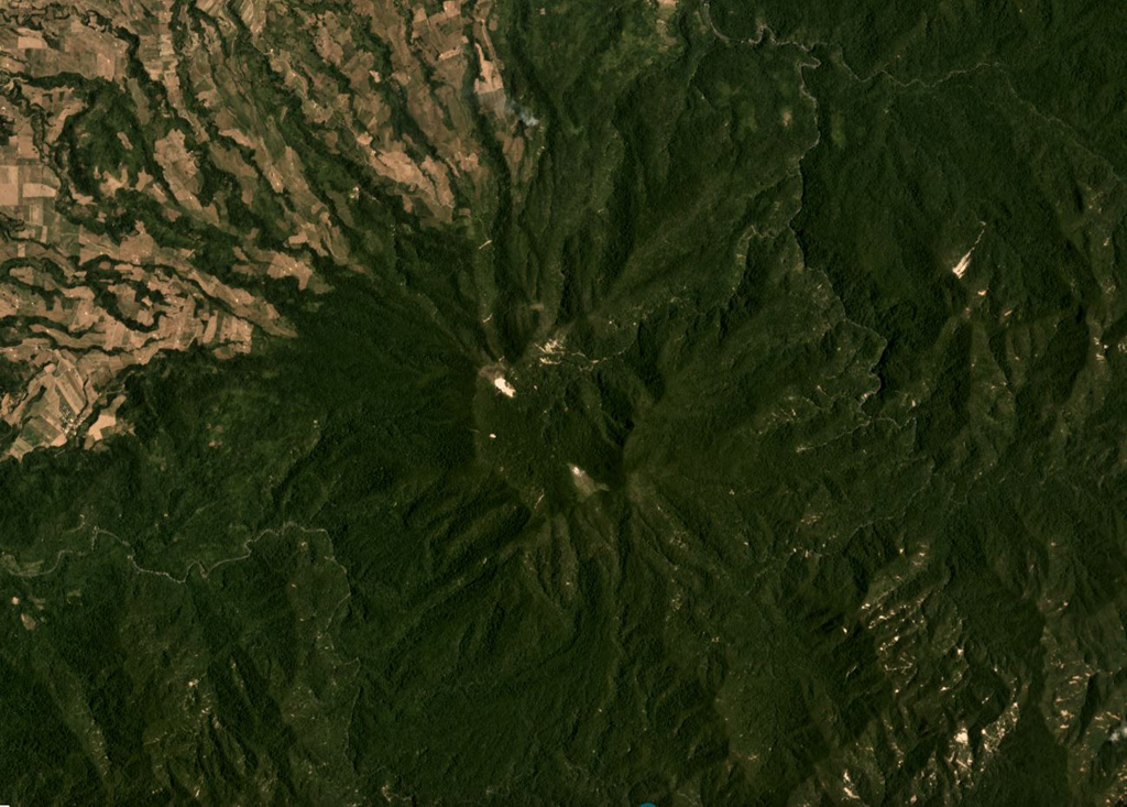 The roughly 2-km-wide Cagua summit crater is in the center of this April 2019 Planet Labs satellite image monthly mosaic (N is at the top), at the NE peninsula of Luzon island. The flanks contain thick pyroclastic flow deposits that were emplaced 600,000 to 300,000 years ago and are now eroded. Satellite image courtesy of Planet Labs Inc., 2019 (https://www.planet.com/).