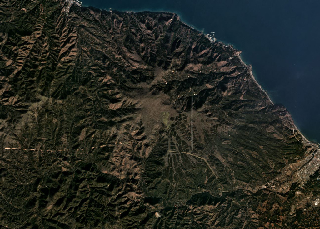 The Pleistocene Mutsu-Hiuchidake is the northernmost volcano on Honshu, seen here in this November 2019 Planet Labs satellite image monthly mosaic (N is at the top; this image is approximately 14 km across). Geothermal activity continues in the area. Satellite image courtesy of Planet Labs Inc., 2019 (https://www.planet.com/).