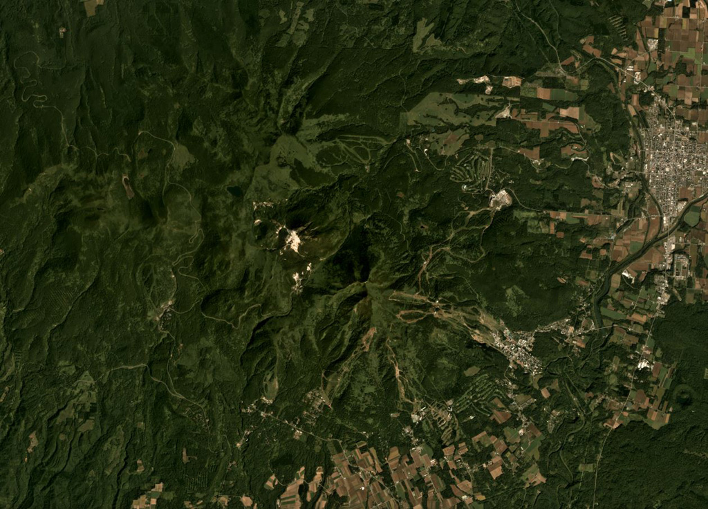 The Niseko complex is shown in this September 2019 Planet Labs satellite image monthly mosaic (N is at the top; this image is approximately 18 km across). The complex contains multiple cones and lava domes including Chisenupuri, Iwaonupuri (the light area near the image center), Niseko-Annupuri, and Nitonupuri domes. The small crater near the lower right corner is Hangetsu-ko of Yoteizan volcano. Satellite image courtesy of Planet Labs Inc., 2019 (https://www.planet.com/).