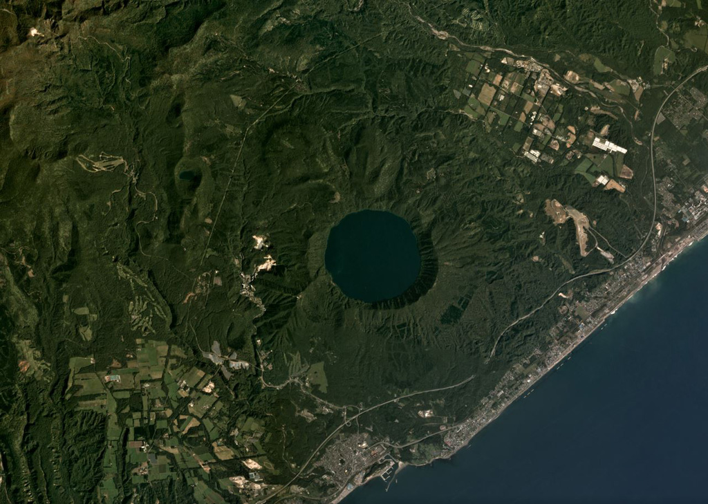 The 3-km-wide Kuttara caldera formed 40,000 years ago and contains Lake Kuttara, shown in this September 2019 Planet Labs satellite image monthly mosaic (N is at the top). The complex also contains cones, domes, and craters, and has ongoing geothermal activity. The Noboribetsu geothermal field and the Hiyoriyama Cryptodome are on the W flank, approximately 1.3 km from the lake edge in this view. Satellite image courtesy of Planet Labs Inc., 2019 (https://www.planet.com/).
