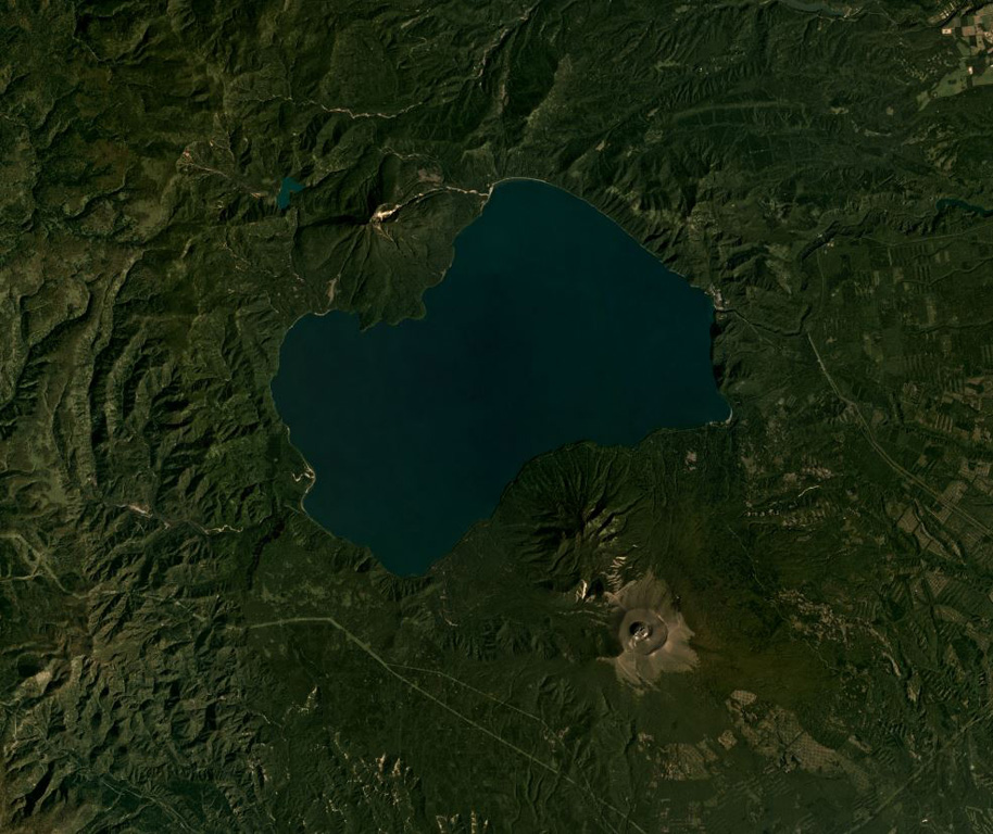 The 14 x 12 km Shikotsu caldera is shown in this September 2019 Planet Labs satellite image monthly mosaic (N is at the top; this image is approximately 28 km across). Tarumae is the cone on the SE rim of the caldera with a roughly 1.5-km-wide crater containing a lava dome. Between Tarumae and the caldera lake is the eroded Fuppushi cone. On the opposite (NW) side of the caldera is the Eniwa cone. Satellite image courtesy of Planet Labs Inc., 2019 (https://www.planet.com/).
