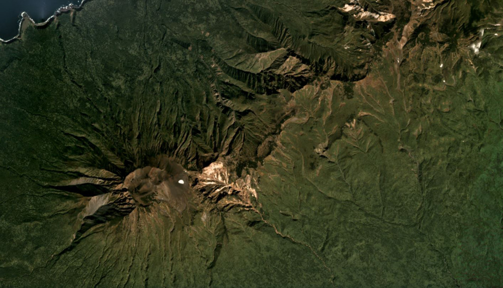 Hitokappu Volcano Group (also called Bogatyr Ridge) is seen diagonally across this September 2019 Planet Labs satellite image monthly mosaic (N is at the top; this image is approximately 13 km across). Stokap is the edifice on the SW end of the ridge and has 8-10 identified domes, cones, and craters at the summit area. Satellite image courtesy of Planet Labs Inc., 2019 (https://www.planet.com/).