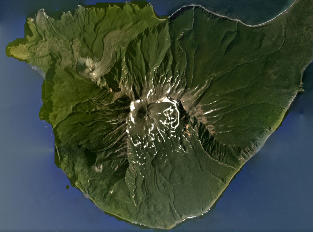 Milna is the southernmost volcano on Simushir island, shown in this August 2020 Planet Labs satellite image monthly mosaic (N is at the top; this image is approximately 13 km across). There is a large scarp across the SE side of the island, opening towards the sea. Within the scarp is a lava dome that grew higher than the scarp walls, and on the NW flank is the Goriaschaia Sopka lava dome with lobate lava flows extending the coastline. Satellite image courtesy of Planet Labs Inc., 2020 (https://www.planet.com/).