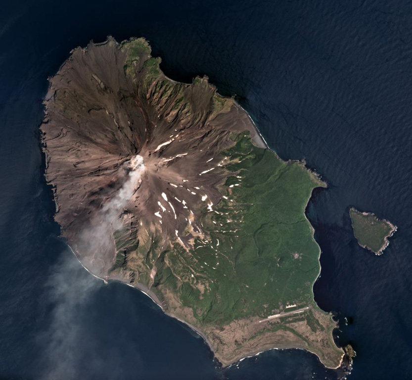 A gas plume is dispersed to the SW of Sarychev Peak in this July 2018 Planet Labs satellite image monthly mosaic (N is at the top; this image is approximately 12 km across). It forms the NW part of the 12 x 6 km Matua Island in the Kurile islands and is one of the most active volcanoes in the area. Lava flows and pyroclastic flow deposits have been emplaced across the flanks, with some pyroclastic flows having reached the sea during explosive eruptions. To the SW of the current edifice is the rim of an older caldera. Satellite image courtesy of Planet Labs Inc., 2018 (https://www.planet.com/).