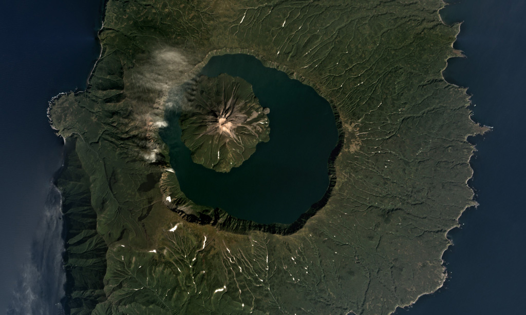 The 7-km-wide Tao-Rusyr Caldera at the southern end of Onekotan Island is shown in this September 2017 Planet Labs satellite image monthly mosaic (N is at the top). The caldera formed at the summit of the broader 16-17 km diameter edifice during an eruption 7,500 years ago, and emplaced a large non-welded ignimbrite deposit. The Krenitsyn Peak cone formed in the NW side of the caldera. Satellite image courtesy of Planet Labs Inc., 2017 (https://www.planet.com/).