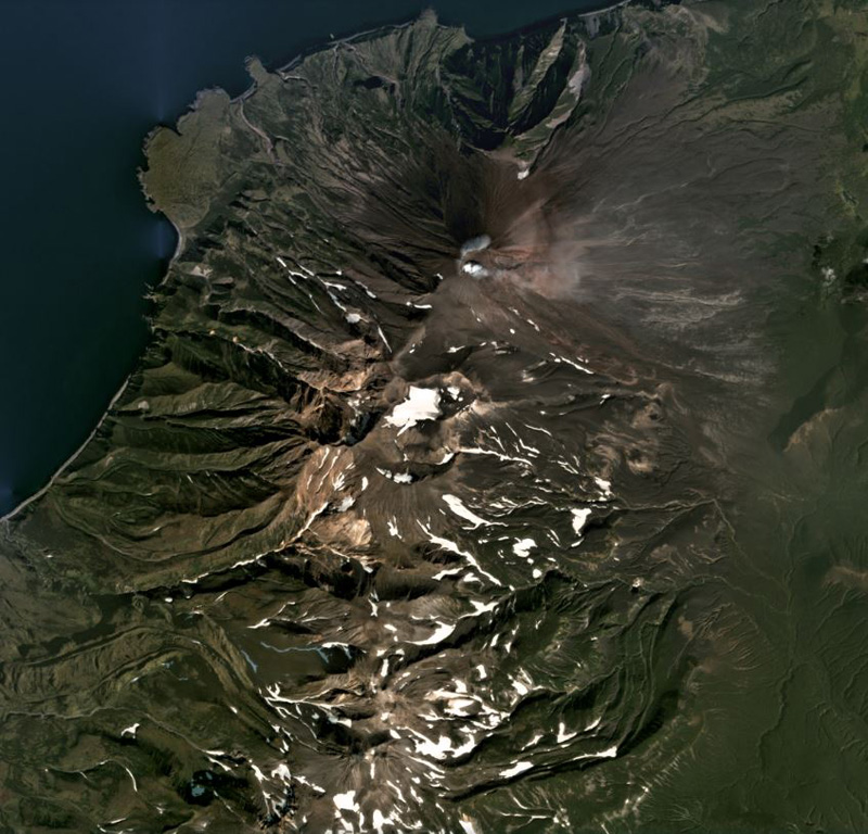 Chikurachki is the northern-most edifice of the Chikurachki-Tatarinov-Lomonosov volcanic chain on the Kurile’s Paramushir Island, shown in this September 2020 Planet Labs satellite image monthly mosaic (N is at the top; this image is approximately 18 km across). The summit has a roughly 450-m-diameter summit crater that is emitting a weak plume dispersing to the E in this image. Tatarinov is the group of craters south of the oxidized Chikurachki cone, and the Lomonsov Group is near the center of the bottom of this image. Satellite image courtesy of Planet Labs Inc., 2020 (https://www.planet.com/).