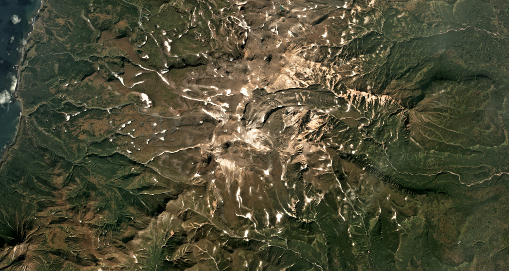 The Vernadskii Ridge in northern Paramushir Island is in the center of this September 2017 Planet Labs satellite image monthly mosaic (N is at the top; this image is approximately 22 km across). The ridge has three main volcano groups including the Vernadskii volcano group in the southern end, and the Bogdanovich volcano group 4-5 km north of that. A 3.5-km-long lava flow with levees and compression ridges was emplaced to the N then turned towards the E. Satellite image courtesy of Planet Labs Inc., 2017 (https://www.planet.com/).