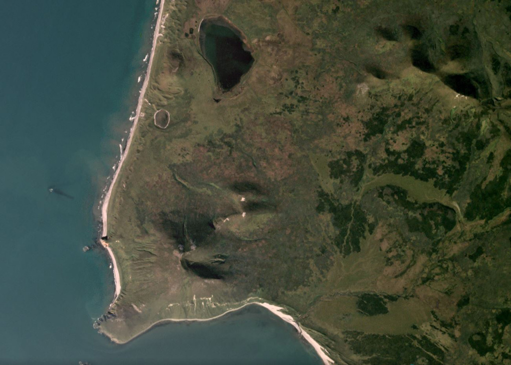 Mashkovtsev is the southernmost Holocene volcano in Kamchatka and forms the small peninsula shown in this September 2019 Planet Labs satellite image monthly mosaic (N is at the top; this image is approximately 5 km across).  The small edifice has a post-glacial summit cone and two scoria cones; lava flows are on the N flank. Satellite image courtesy of Planet Labs Inc., 2019 (https://www.planet.com/).