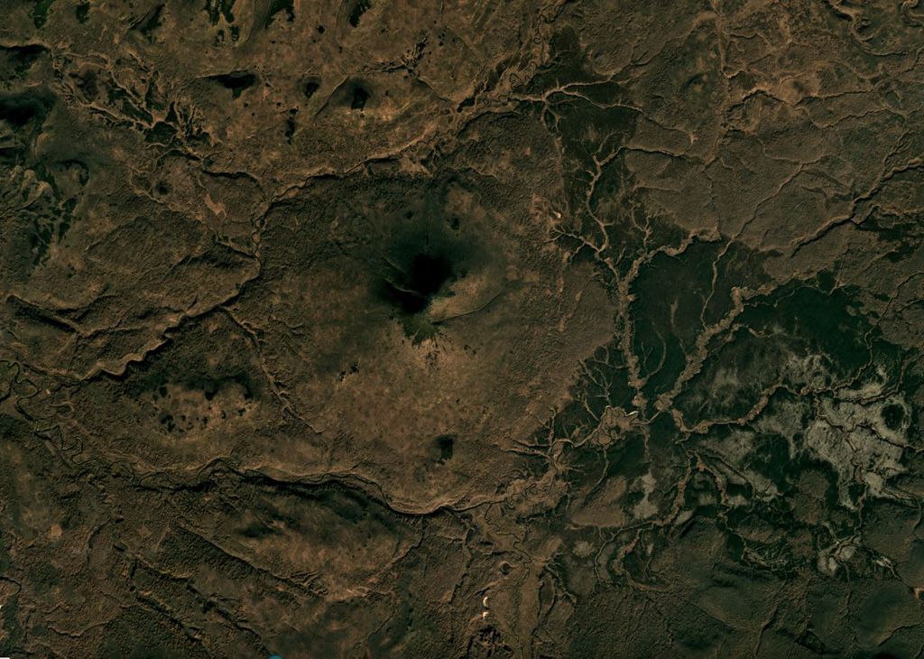 Belenkaya is the small cone in the center of this October 2018 Planet Labs satellite image monthly mosaic (N is at the top; this image is approximately 16 km across). Exposures show that it formed through the emplacement of thin overlapping lava flows. Satellite image courtesy of Planet Labs Inc., 2018 (https://www.planet.com/).