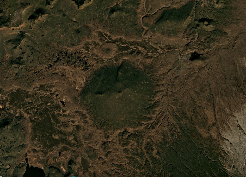 Ozerny is the vegetated low-relief cone in the center of this October 2018 Planet Labs satellite image monthly mosaic (N is at the top; this image is approximately 15 km across). The summit is a scoria cone without a preserved crater, and lava flows reach 1 km N and 1.5 km W. Satellite image courtesy of Planet Labs Inc., 2018 (https://www.planet.com/).