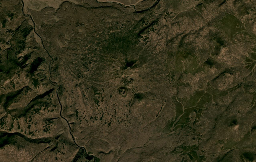 Otdelniy is a small low-relief cone in southern Kamchatka, shown in the center of this October 2020 Planet Labs satellite image monthly mosaic (N is at the top; this image is approximately 14 km across). The central area has several small scoria cones with summit craters, with one cone on the southern flank having nested craters. Satellite image courtesy of Planet Labs Inc., 2020 (https://www.planet.com/).