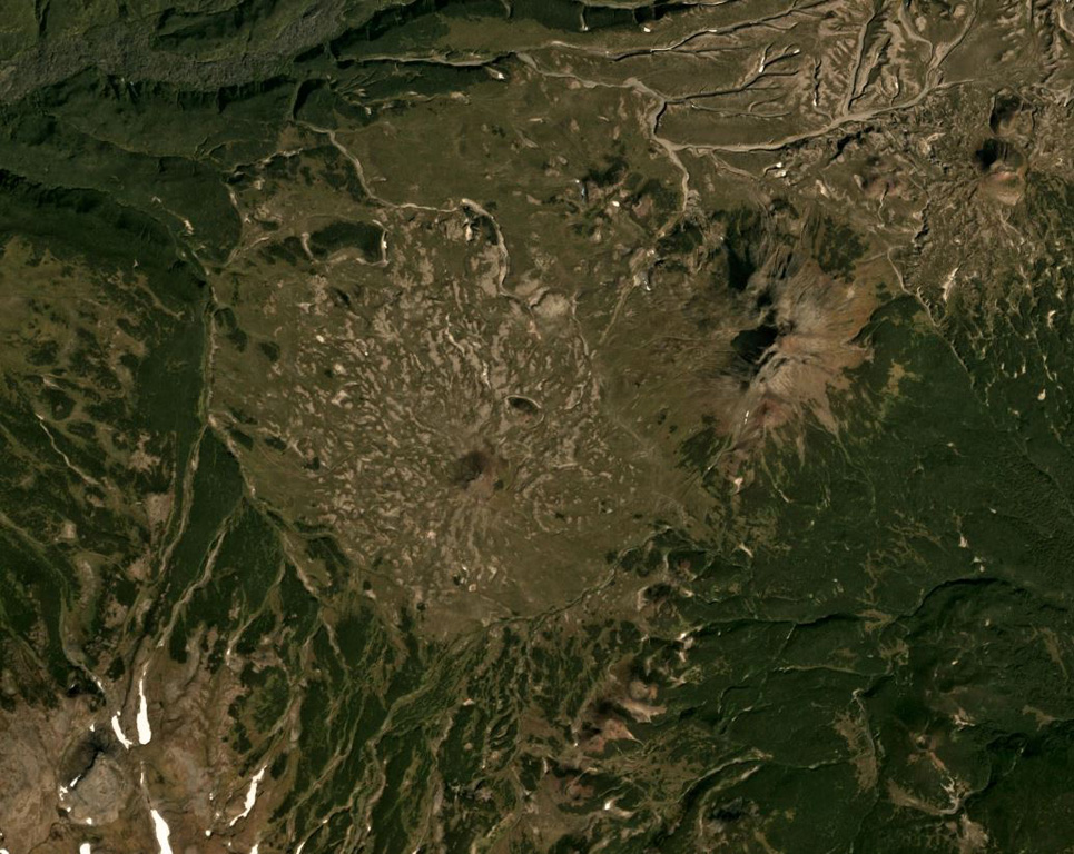 The Visokiy peak is just NE of the center of this September 2019 Planet Labs satellite image monthly mosaic (N is at the top; this image is approximately 15 km across). The smaller cone to the SW (near the center) is Golyi. The volcano is located between Mutnovsky to the NE and Asacha to the SW. Satellite image courtesy of Planet Labs Inc., 2019 (https://www.planet.com/).
