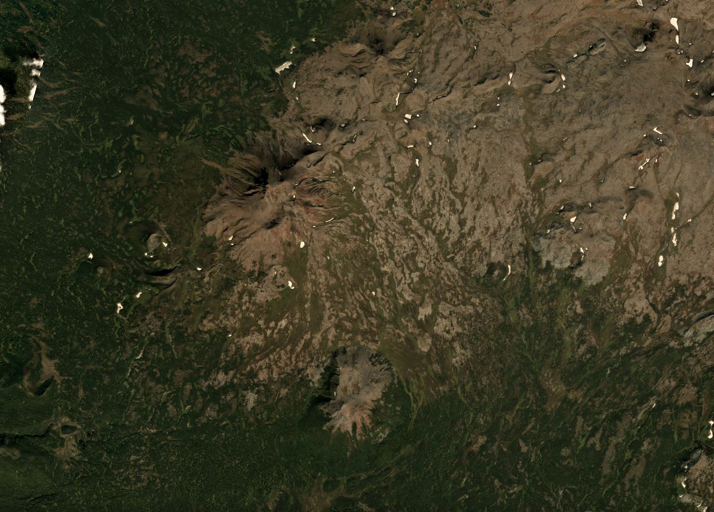 The Leutongey shield volcano has produced scoria cones and lava flows, with several of these near the center of this September 2018 Planet Labs satellite image monthly mosaic (N is at the top; this image is approximately 14 km across). The two larger cones are near the center of this image, the relatively western cone with a 500-m-diameter crater and the southern Medvevezhy cone. Satellite image courtesy of Planet Labs Inc., 2018 (https://www.planet.com/).