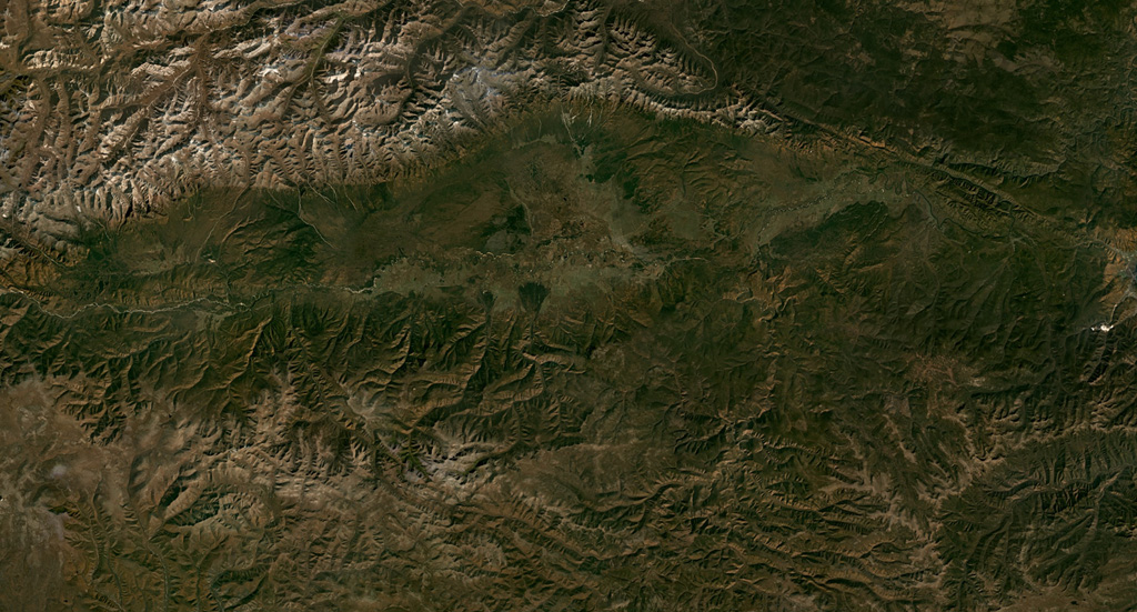 Beyond the NW tip of Lake Baikal is the Tunkin (or Tunka) Depression volcanic field, shown in this September 2019 Planet Labs satellite image monthly mosaic (N is at the top; this image is approximately 170 km across). The field is the surface manifestation of a rift zone and contains five main groups of scoria cones and lava flows that were produced during the late-Pleistocene to Holocene. Satellite image courtesy of Planet Labs Inc., 2019 (https://www.planet.com/).