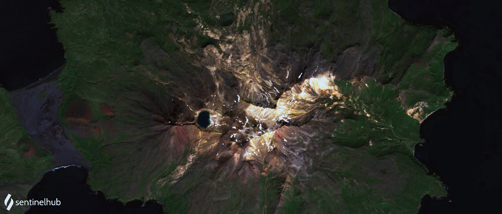 The Tana volcanic complex is the eastern part of Chuginadak Island, shown in this 23 August 2020 Sentinel-2 satellite image (N is at the top; this image is approximately 17 km across). The summit area is a nearly E-W alignment of volcanic centers, with the lake-filled summit crater on the western end. From the western rim of that crater is the E-W Tana fissure, and from there down into the Chuginadak isthmus are additional younger fissures and scoria cones. Cleveland volcano forms the western part of the island. Satellite image courtesy of Planet Labs Inc., 2020 (https://www.planet.com/).