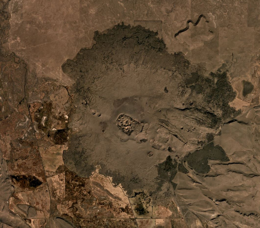 The 70 km2 Diamond Craters volcanic field in Oregon, USA, is shown in this October 2019 Planet Labs satellite image monthly mosaic (N is at the top; this image is approximately 15 km across). The area was uplifted to produce graben structures cross-cutting the lavas in NW-SE direction. Numerous smaller vents including spatter and phreatomagmatic craters, and cones occur along the margins of the uplifted area aligned with the structural trend. Satellite image courtesy of Planet Labs Inc., 2019 (https://www.planet.com/).