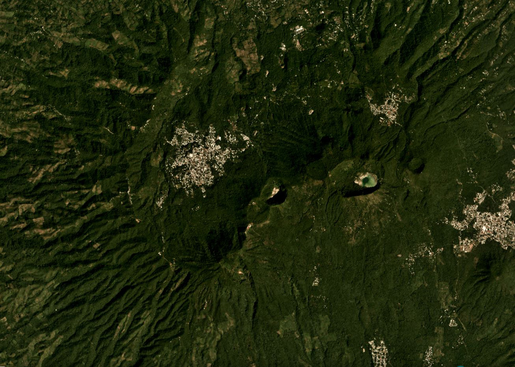 The Tecapa volcanic complex contains the cones and craters through the center of this November 2019 Planet Labs satellite image monthly mosaic (N is at the top; this image is approximately 12 km across). The craters in the NE-SW line from the one in the center in this image are Hoyon (center), Cerro Peylon, and Cerro Las Palmas; the Ausoles de la Laguna de Alegría thermal area is within the crater containing the lake towards the E. Satellite image courtesy of Planet Labs Inc., 2019 (https://www.planet.com/).