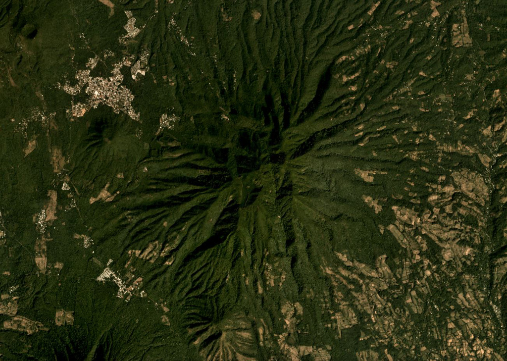 The eroded El Tigre volcano is in the center of this December 2019 Planet Labs satellite image monthly mosaic (N is at the top; this image is approximately 13.5 km across). The eroded cones of Cerro Oromontique and La Manita are below the western and southern flanks, respectively, and the Cerro Alegria crater is in the NW corner of this image. Satellite image courtesy of Planet Labs Inc., 2019 (https://www.planet.com/).