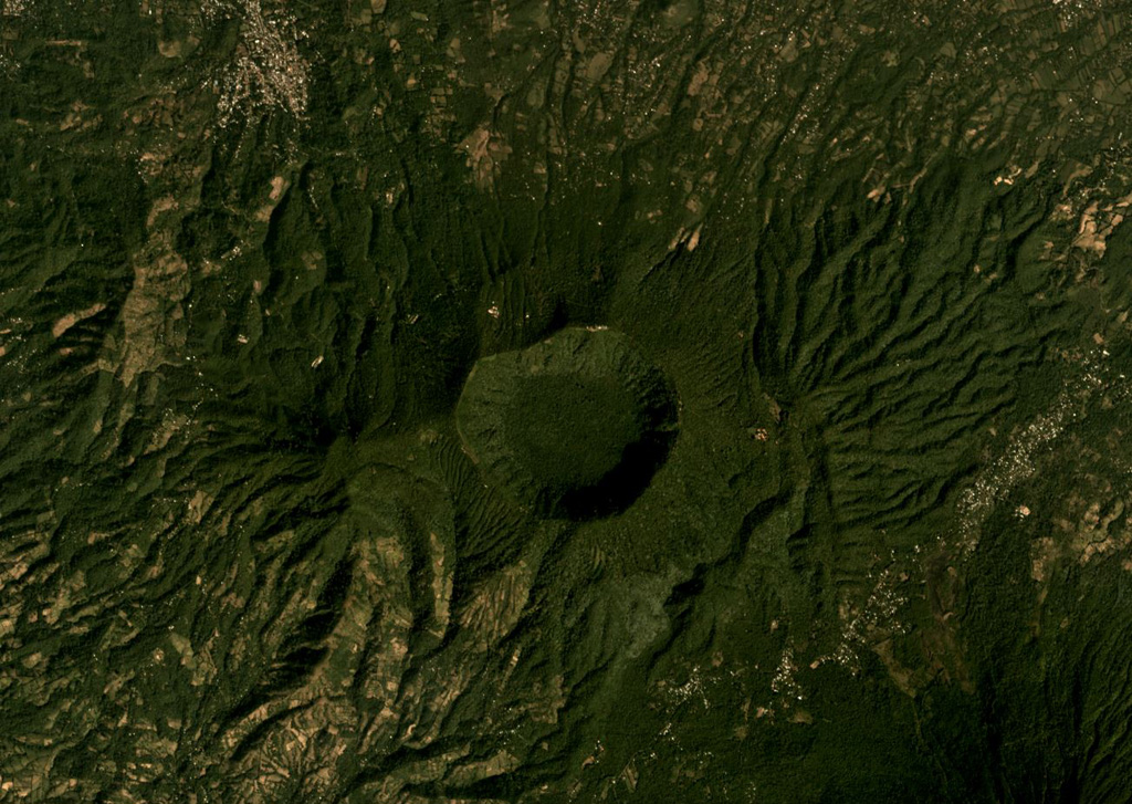 The 2.4-km-wide Laguna Seca el Pacayal is the caldera of Chinameca in the center of this December 2019 Planet Labs satellite image monthly mosaic (N is at the top). The smaller cone on the SW flank is Cerro el Limbo with a summit reaching above the caldera rim. Satellite image courtesy of Planet Labs Inc., 2019 (https://www.planet.com/).